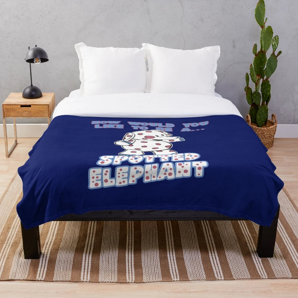 Spotted elephant plush blanket featuring a misfit toy design