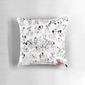 A collage of spotted dalmatian puppies on a decorative throw pillow