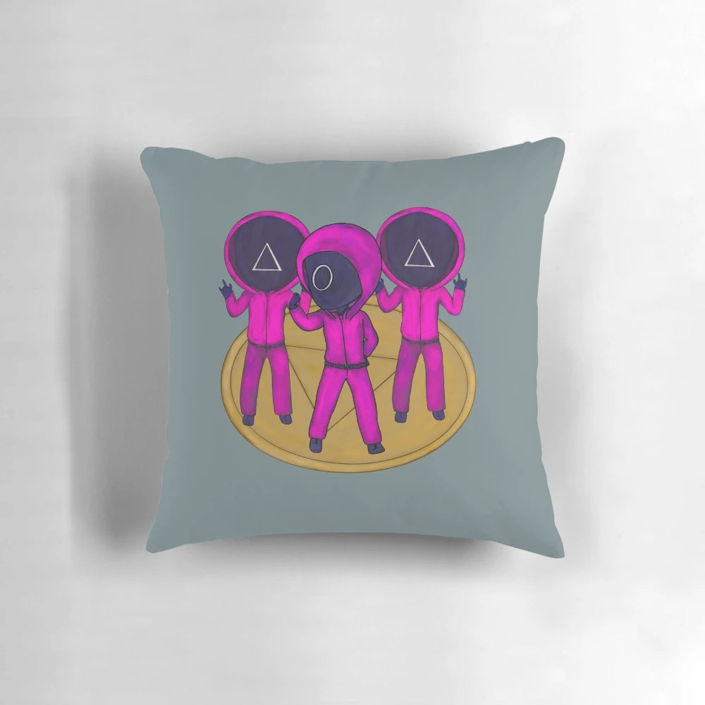 Squid Game inspired boyband-themed decorative pillow featuring pink soldiers, masked men, and dalgona cookies