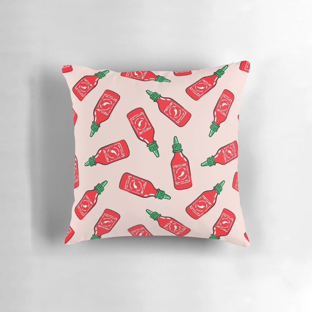 Sriracha sauce-inspired polka dot throw pillow with arrow design, a bold and vibrant home accent.