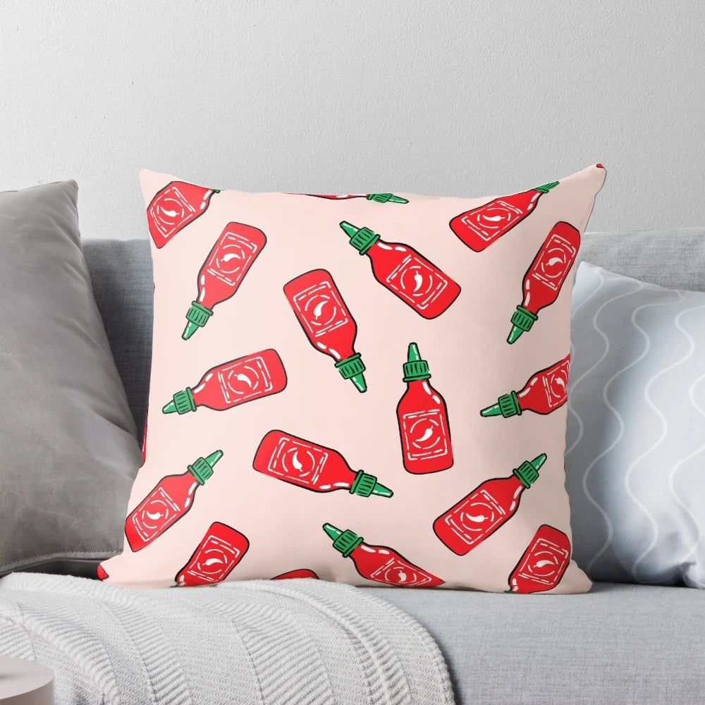 Sriracha sauce-inspired polka dot throw pillow with arrow design, a bold and vibrant home accent.