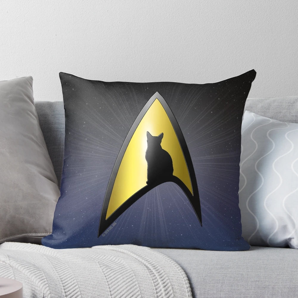 Starfleet cat silhouette design on a black and gold decorative pillow