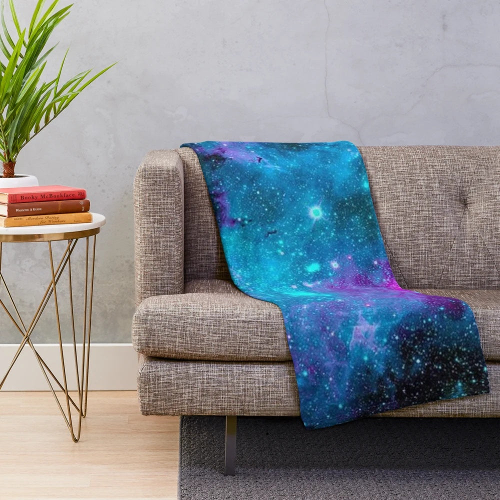 Starry galaxy plush blanket with purple, blue and cosmic design