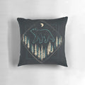 A soft, plush pillow featuring a bear under a starry night sky