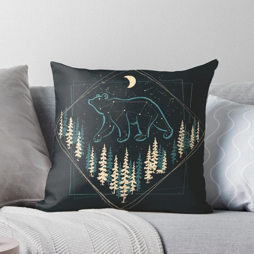 A soft, plush pillow featuring a bear under a starry night sky