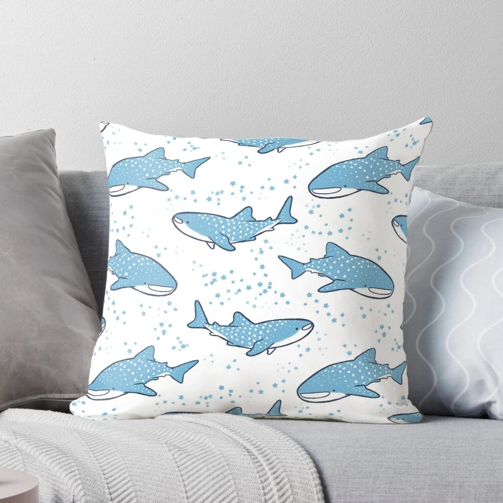 A decorative throw pillow featuring a cute cartoon whale shark swimming against a starry night sky background