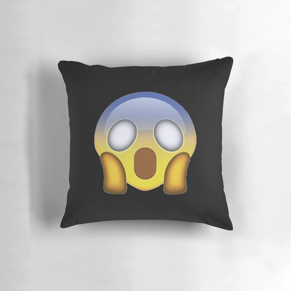 Decorative throw pillow featuring a startled, fearful facial expression emoji or icon