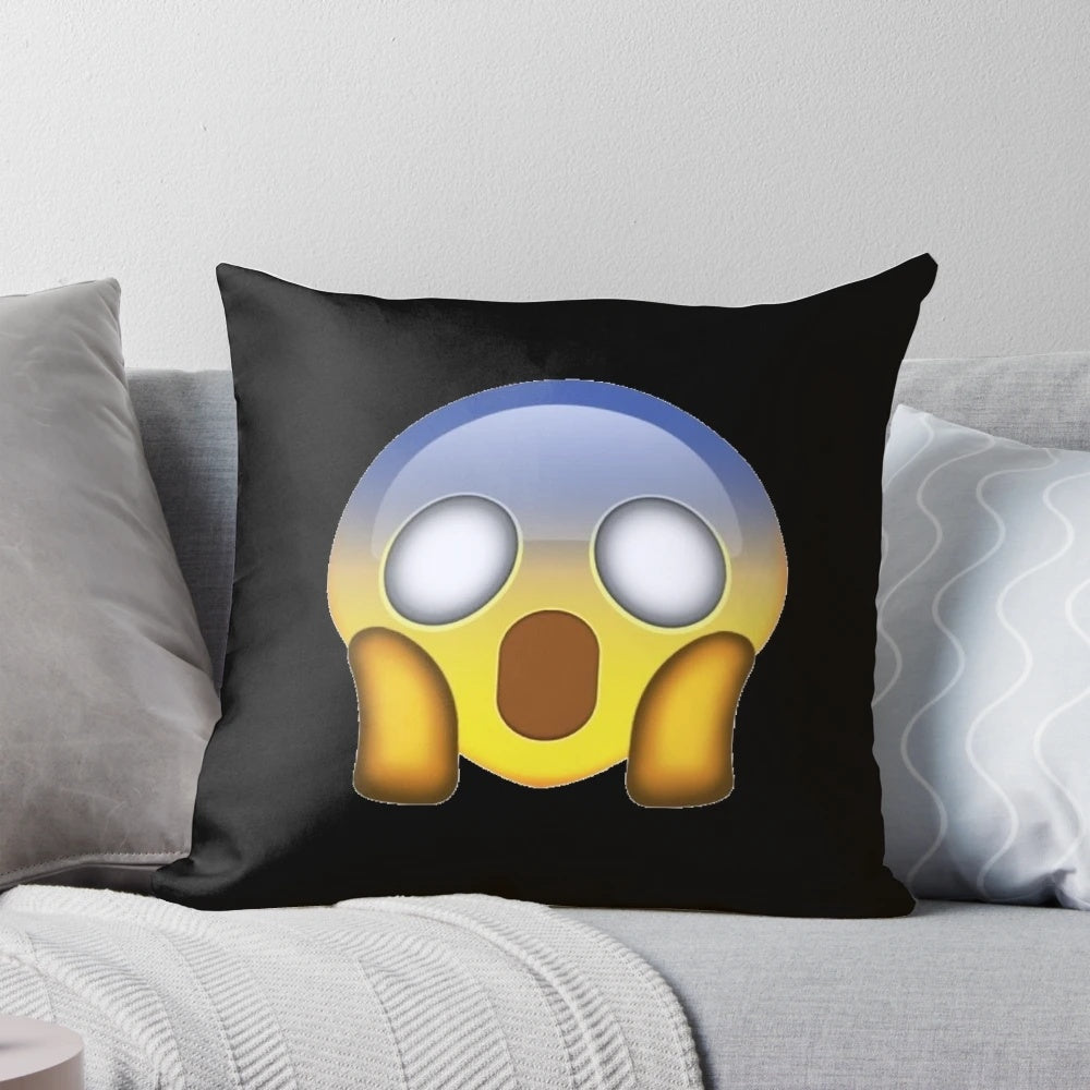 Decorative throw pillow featuring a startled, fearful facial expression emoji or icon
