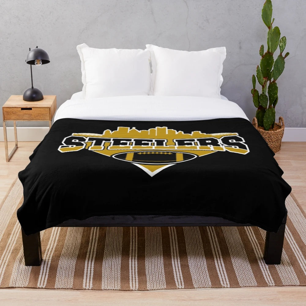 Plush football team blanket featuring the Pittsburgh Steelers skyline design