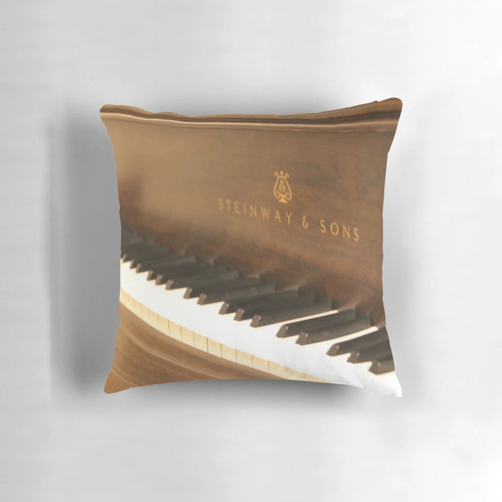 Steinway piano-themed decorative pillow with reflective surface