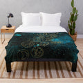 Plush blanket with time lord words in gold on a teal stellar background
