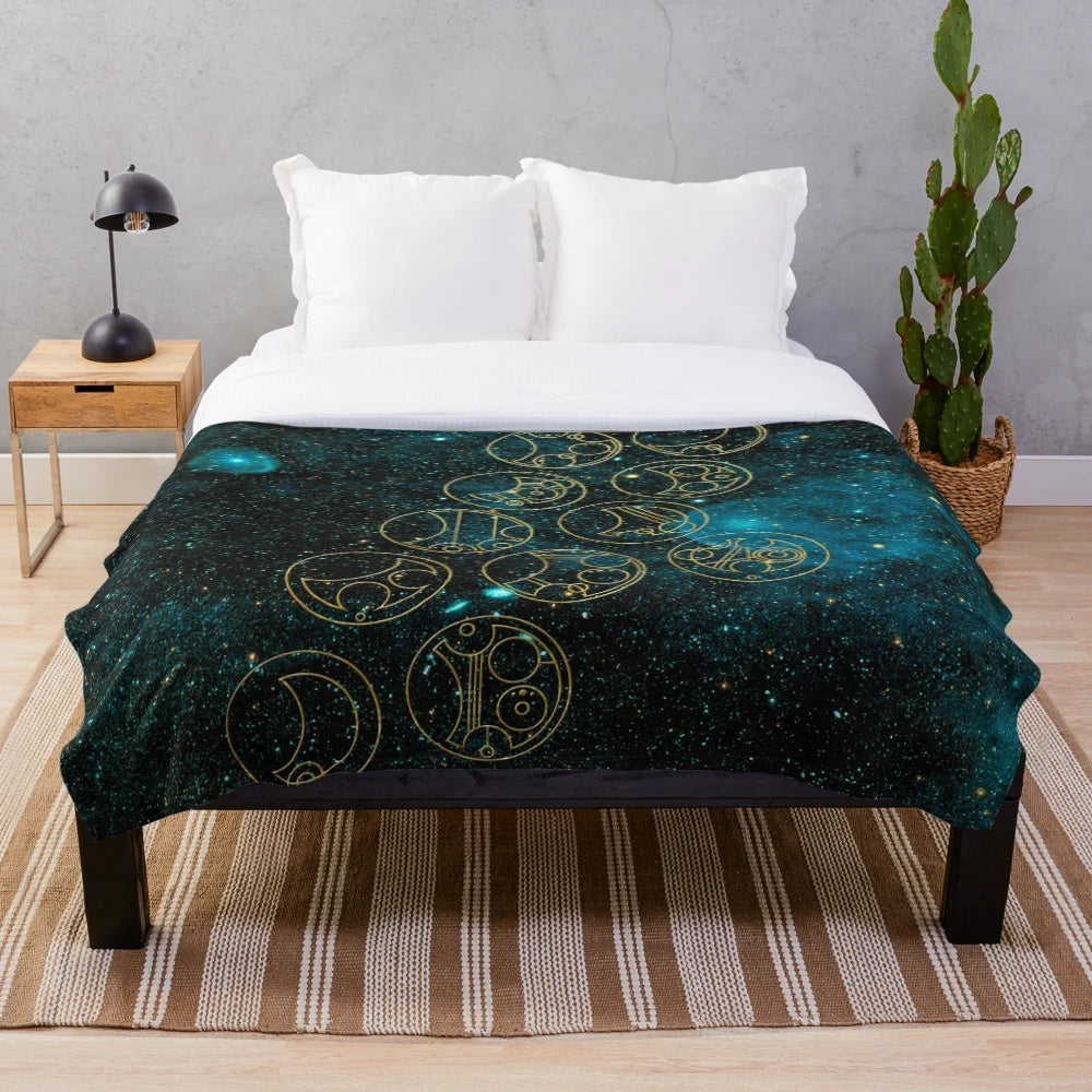 Plush blanket with time lord words in gold on a teal stellar background