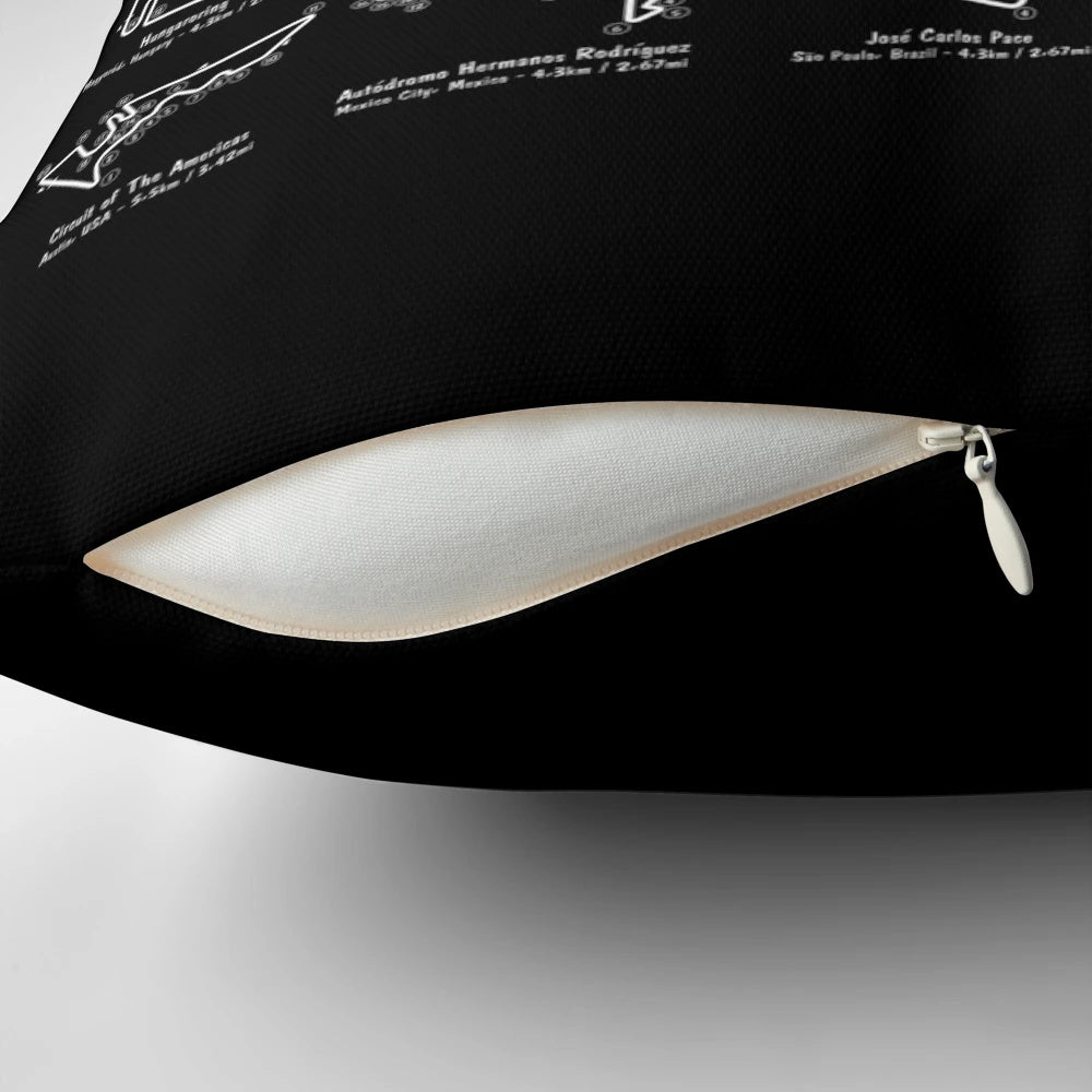 White stencil-style graphic of an F1 race track printed on a throw pillow.