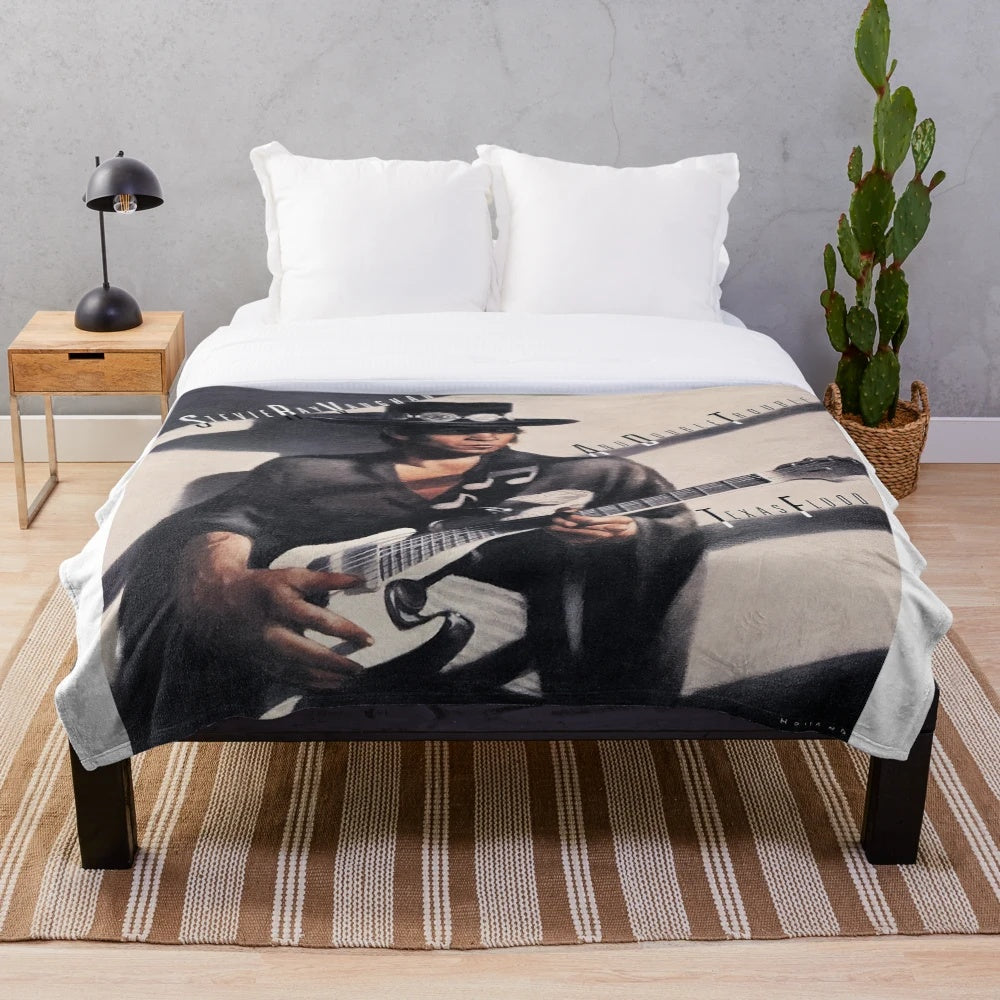 Plush blanket featuring the iconic "Texas Flood" album cover art of Stevie Ray Vaughan.