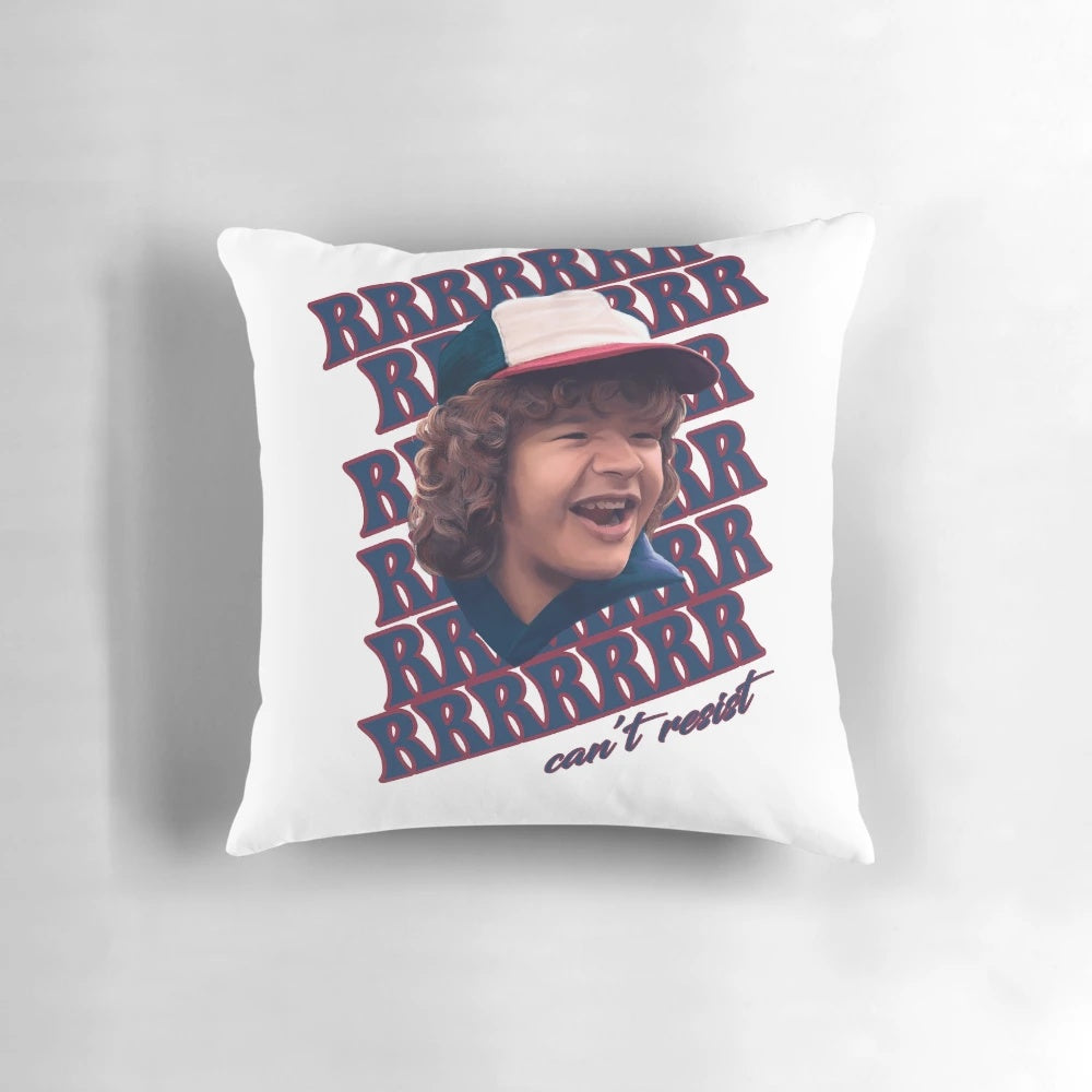 A cozy pillow featuring the character Dustin from the Netflix series Stranger Things, with the caption "Can't resist those pearls."