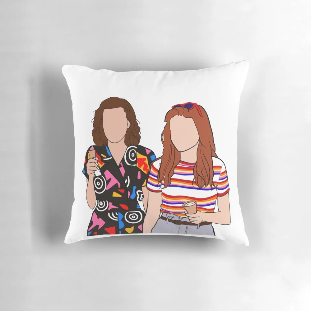 Stranger Things themed pillow featuring characters Eleven and Max