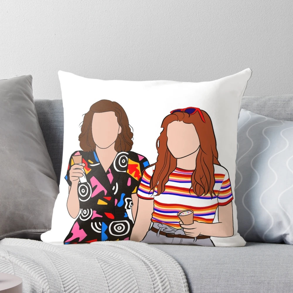 Stranger Things themed pillow featuring characters Eleven and Max