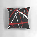 Pillow featuring a bold, abstract pattern of intersecting red and white lines on a black background.
