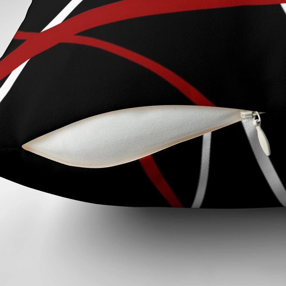 Pillow featuring a bold, abstract pattern of intersecting red and white lines on a black background.