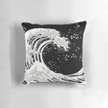 Black and white decorative pillow featuring a bold, graphic wave design