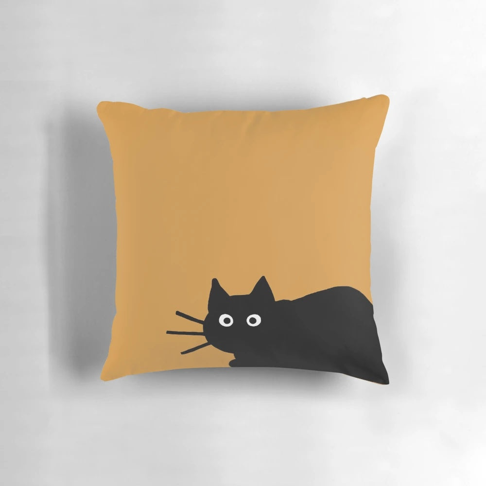 A decorative black cat-themed pillow with a fun, whimsical design.