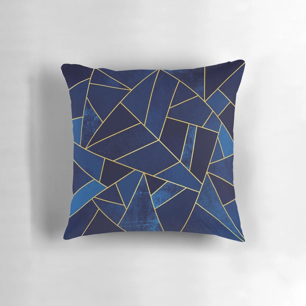 Blue and yellow geometric patterned pillow