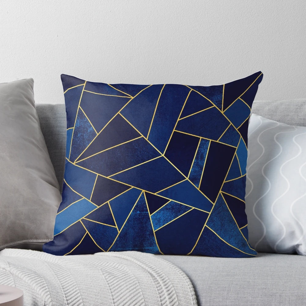 Blue and yellow geometric patterned pillow