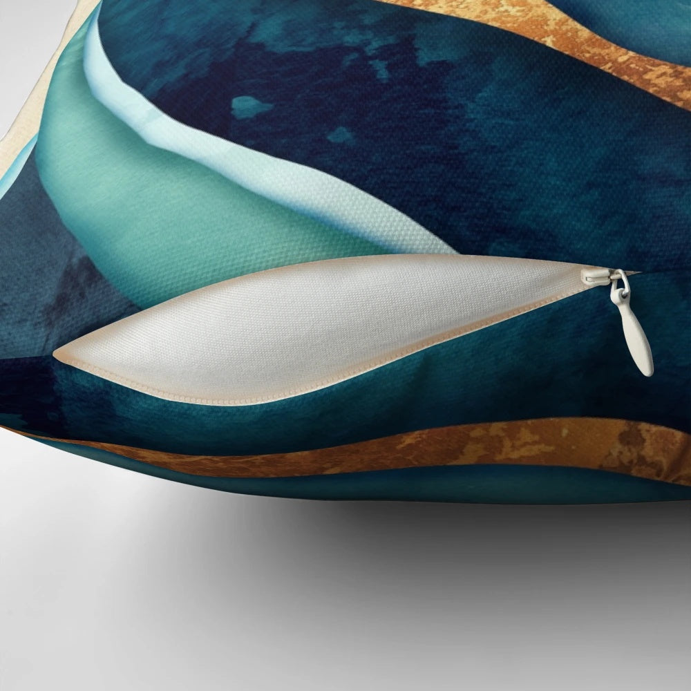 A vibrant abstract accent pillow in shades of blue and gold, creating a bold and modern design.