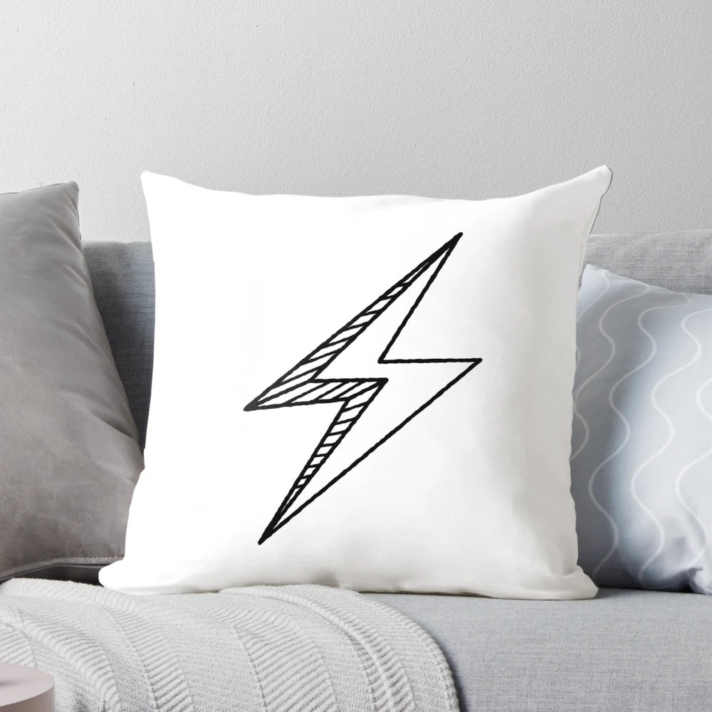 A striking black and white hand drawn lightning bolt design on a decorative throw pillow.