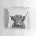 A black and white portrait illustration of a majestic Highland cow on a pillow
