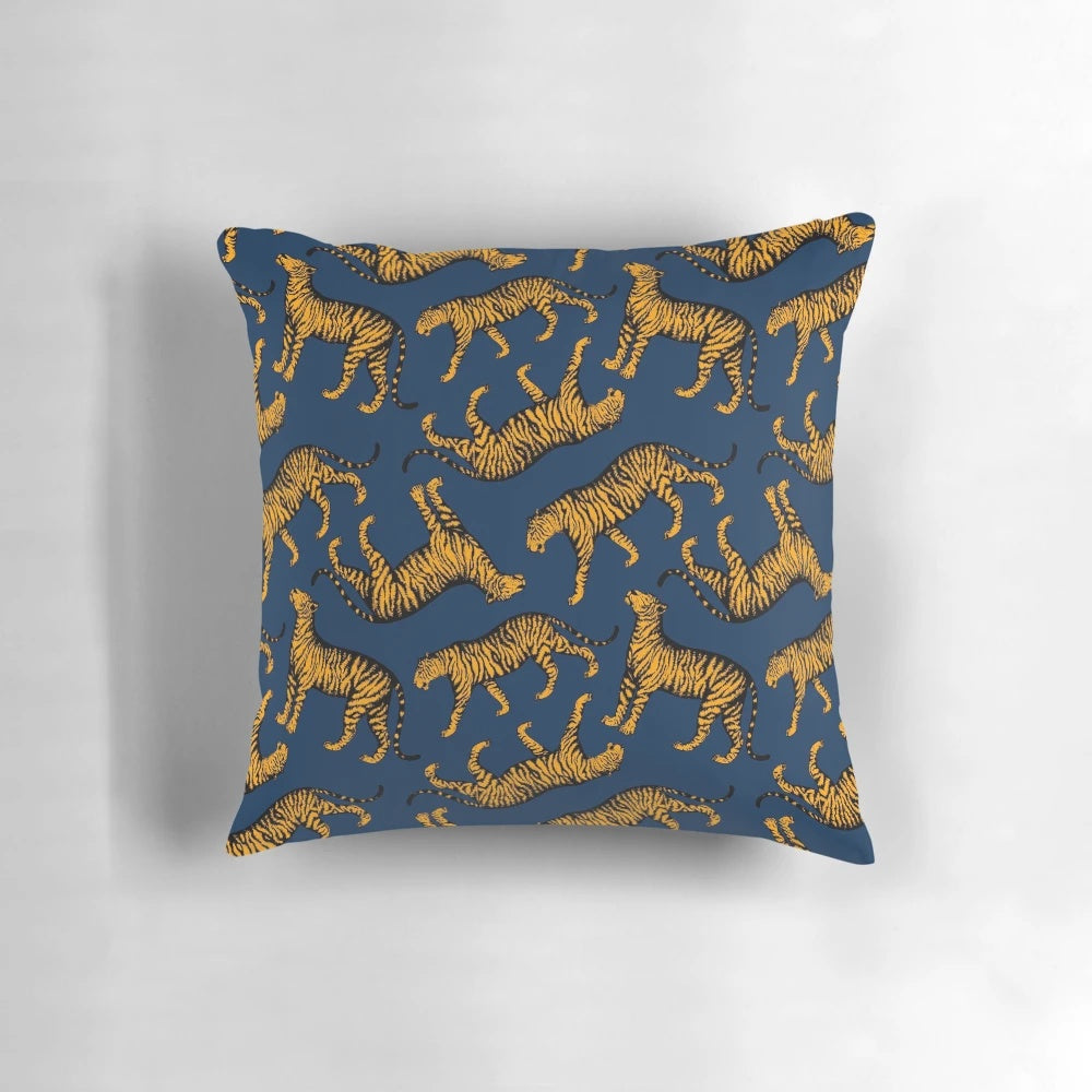 Decorative throw pillow featuring a striking design of tigers in navy blue and marigold colors
