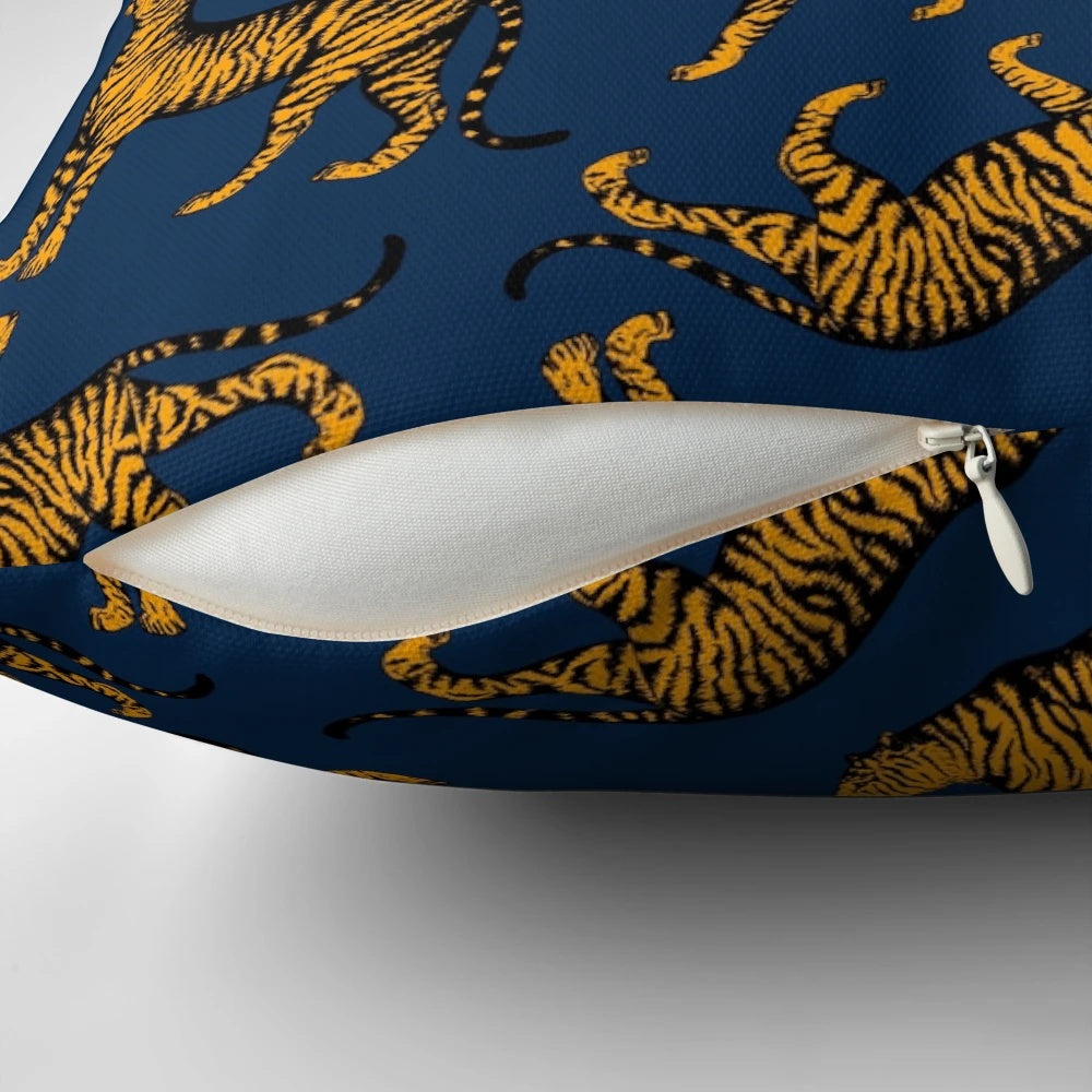 Decorative throw pillow featuring a striking design of tigers in navy blue and marigold colors