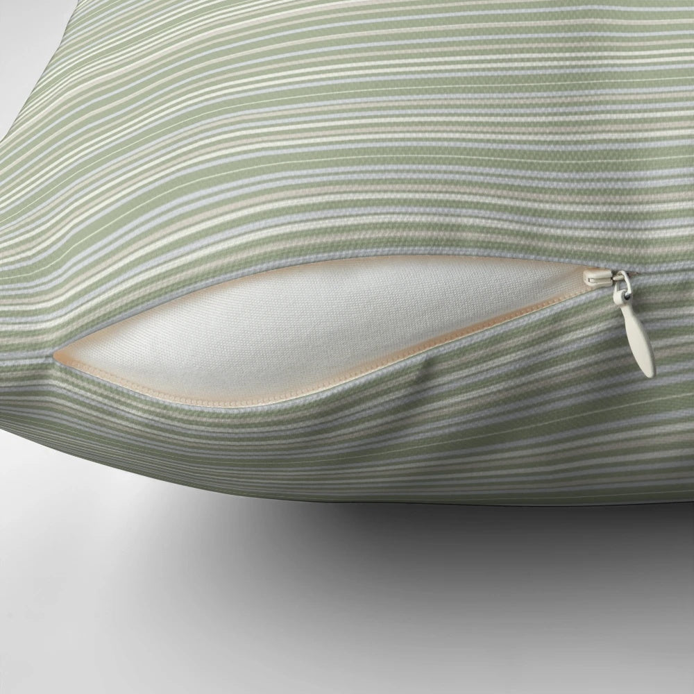 Soft, striped sage green pillow with a minimalist, neutral pattern design.