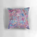 Colorful Aboriginal art pillow featuring a design that represents protecting the land and environment