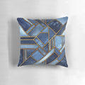 Vibrant abstract geometric pillow in shades of blue and gold with a modern mosaic pattern.