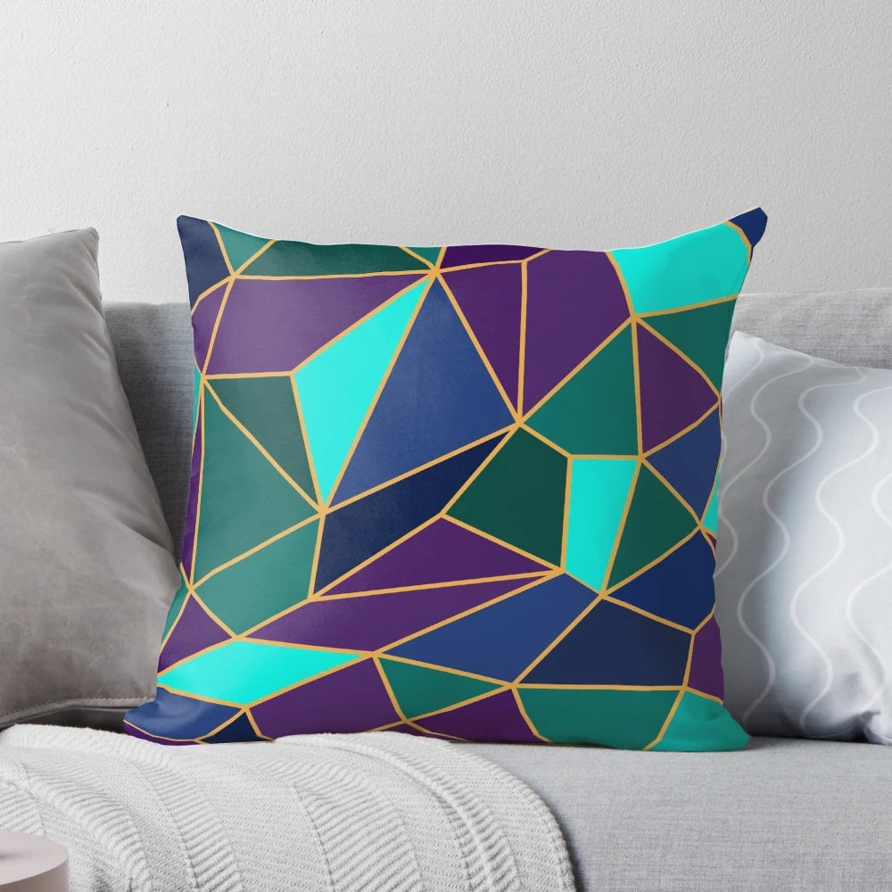A decorative throw pillow featuring an abstract geometric stained glass design in shades of purple and teal.