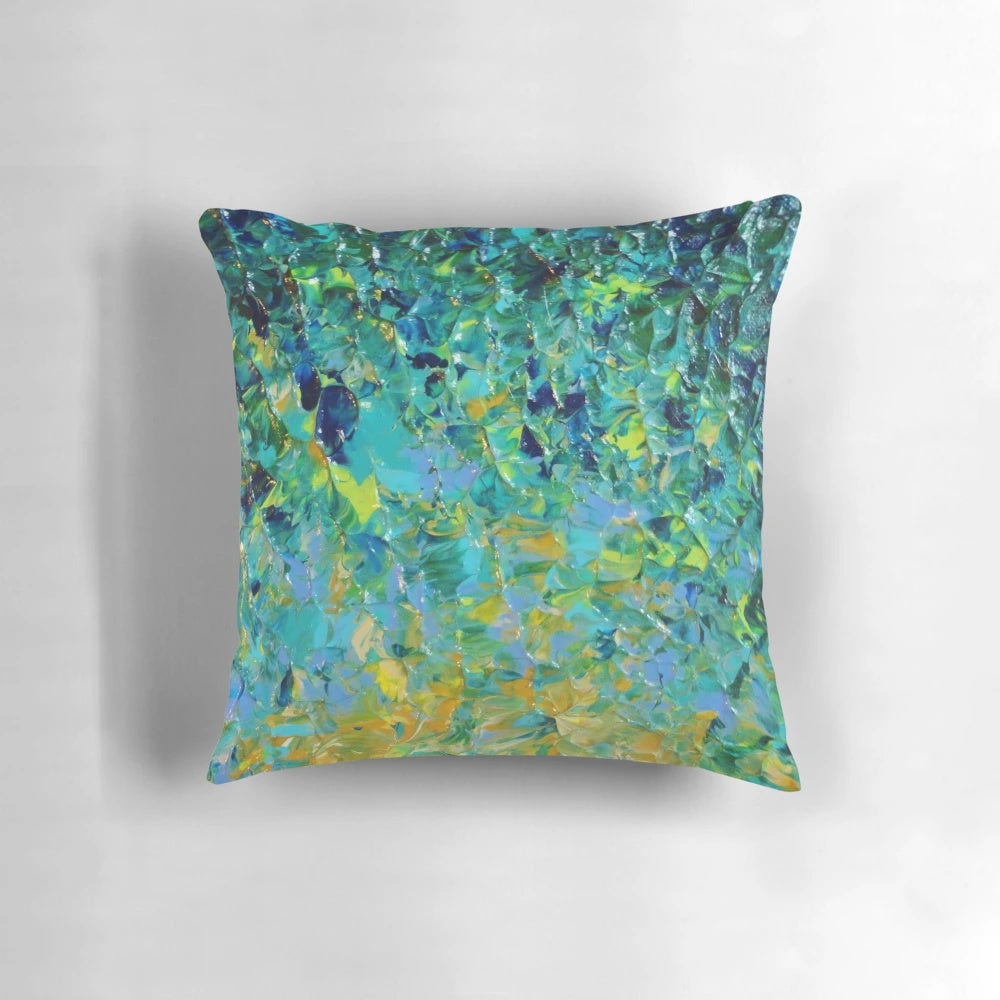 Vibrant abstract art pillow featuring a nature-inspired landscape of water, greenery, and bold colors
