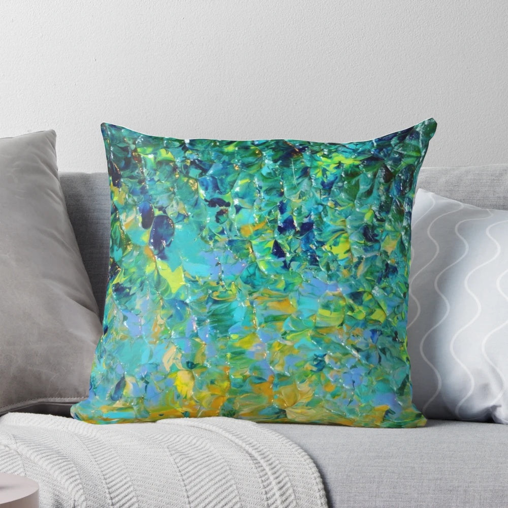 Vibrant abstract art pillow featuring a nature-inspired landscape of water, greenery, and bold colors