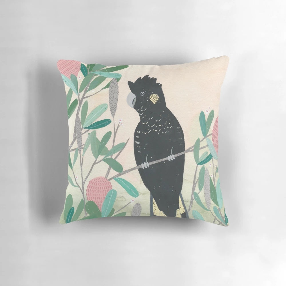 Colorful Australian black cockatoo bird perched on a branch, decorative throw pillow