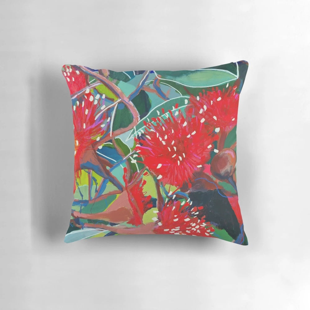 Colorful Australian red gum flowers printed on a soft, high-quality pillow