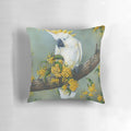 Closeup image of a beautiful Australian white cockatoo perched on a decorative pillow