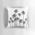 A stylish black and white throw pillow featuring a tropical palm tree pattern.