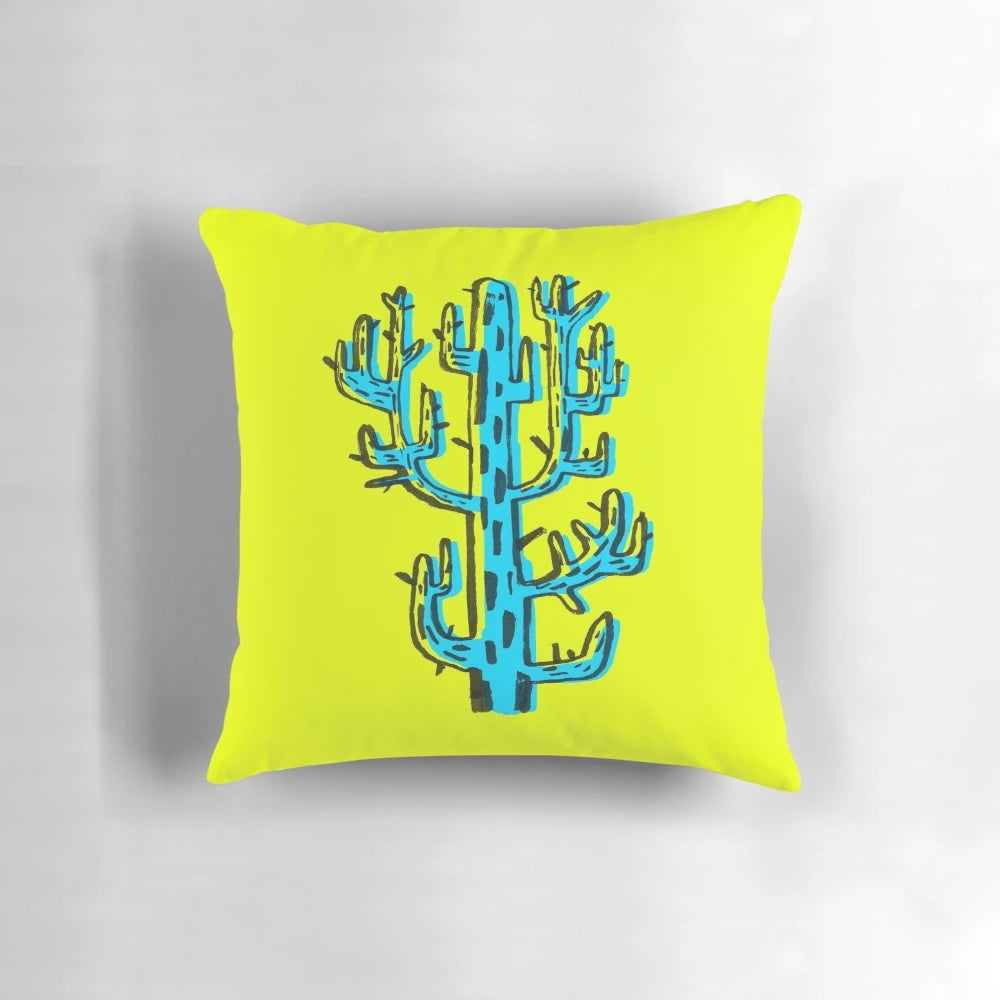 A vibrant blue cactus graphic design pillow with a unique brushpen style.