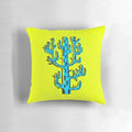 A vibrant blue cactus graphic design pillow with a unique brushpen style.