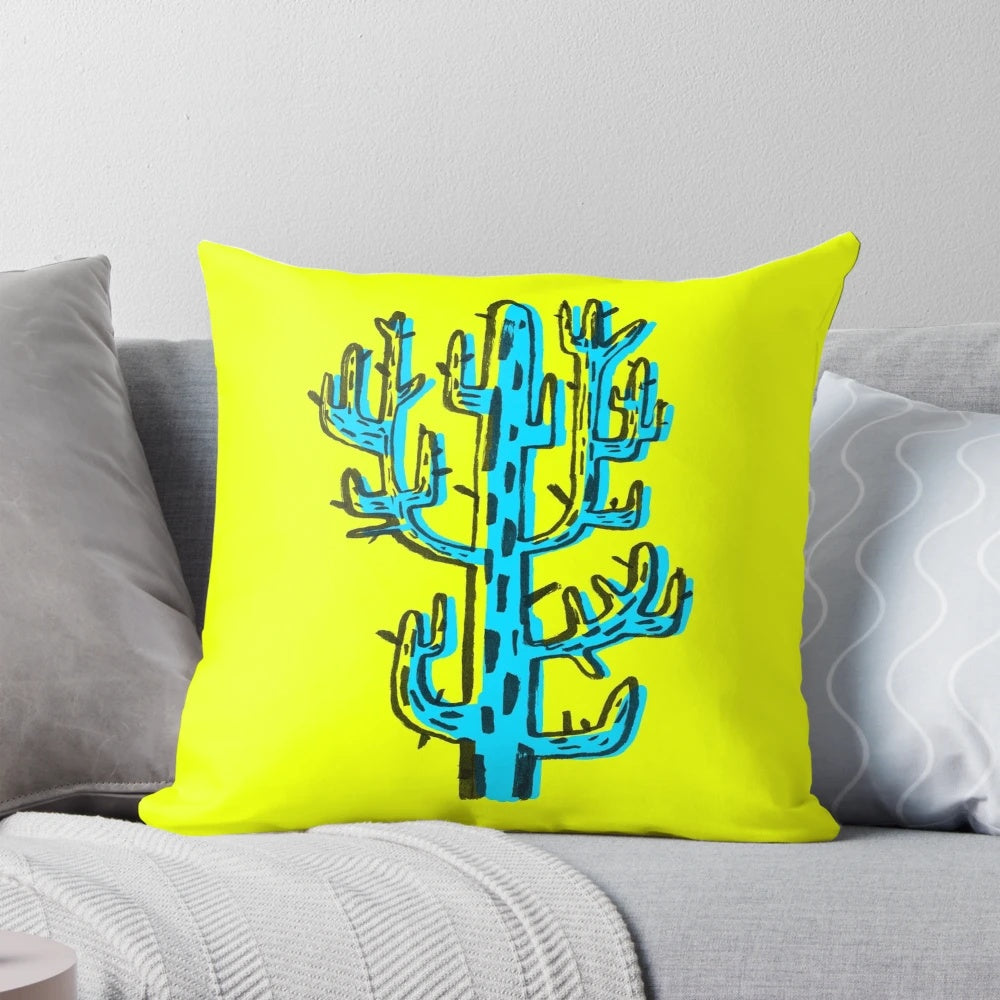 A vibrant blue cactus graphic design pillow with a unique brushpen style.