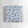 Decorative pillow featuring a blue swallow bird in flight on a stormy grey background