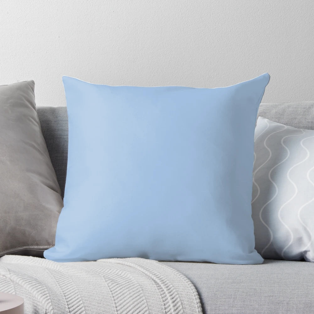 Vibrant Carolina blue pillow with a variety of shades of blue