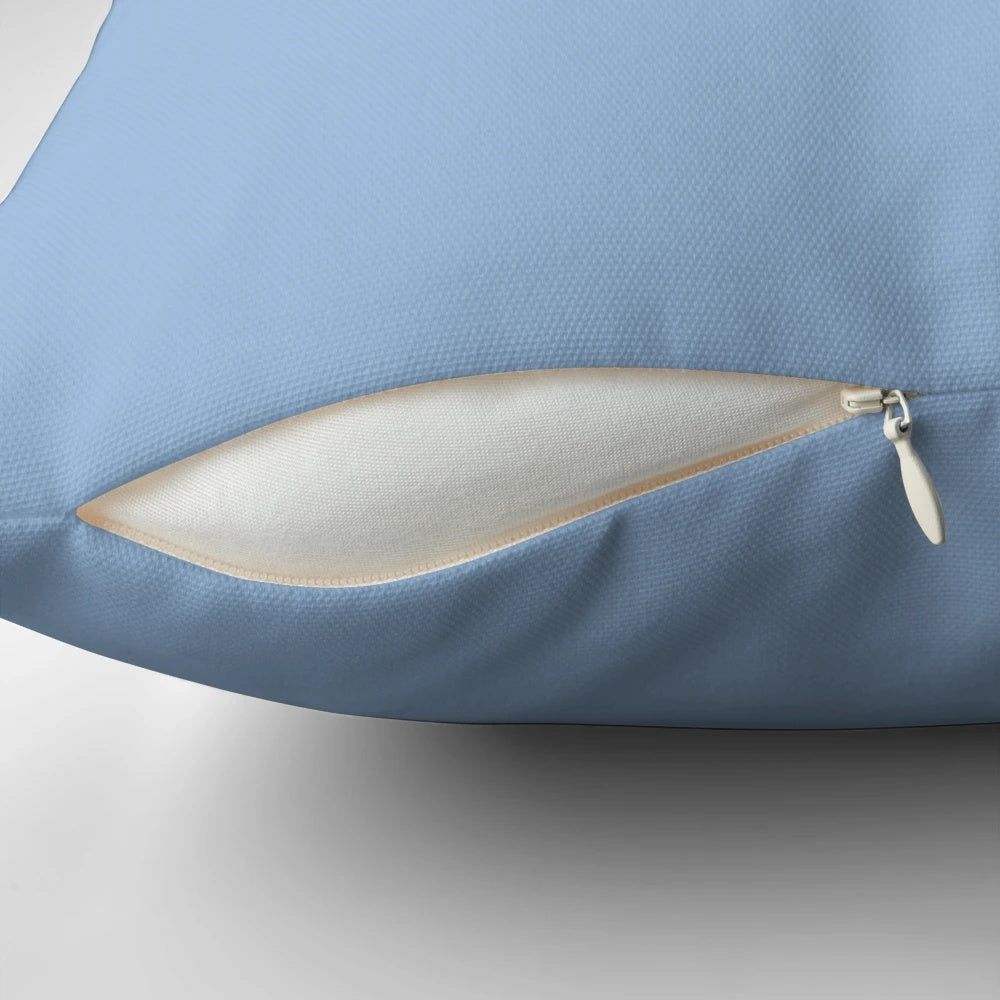 Vibrant Carolina blue pillow with a variety of shades of blue