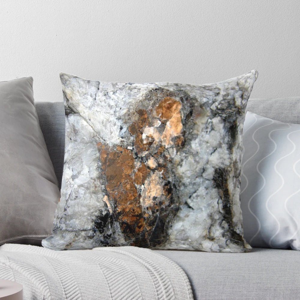 Closeup image of a copper mica pillow, a natural stone with a unique and captivating abstract pattern.