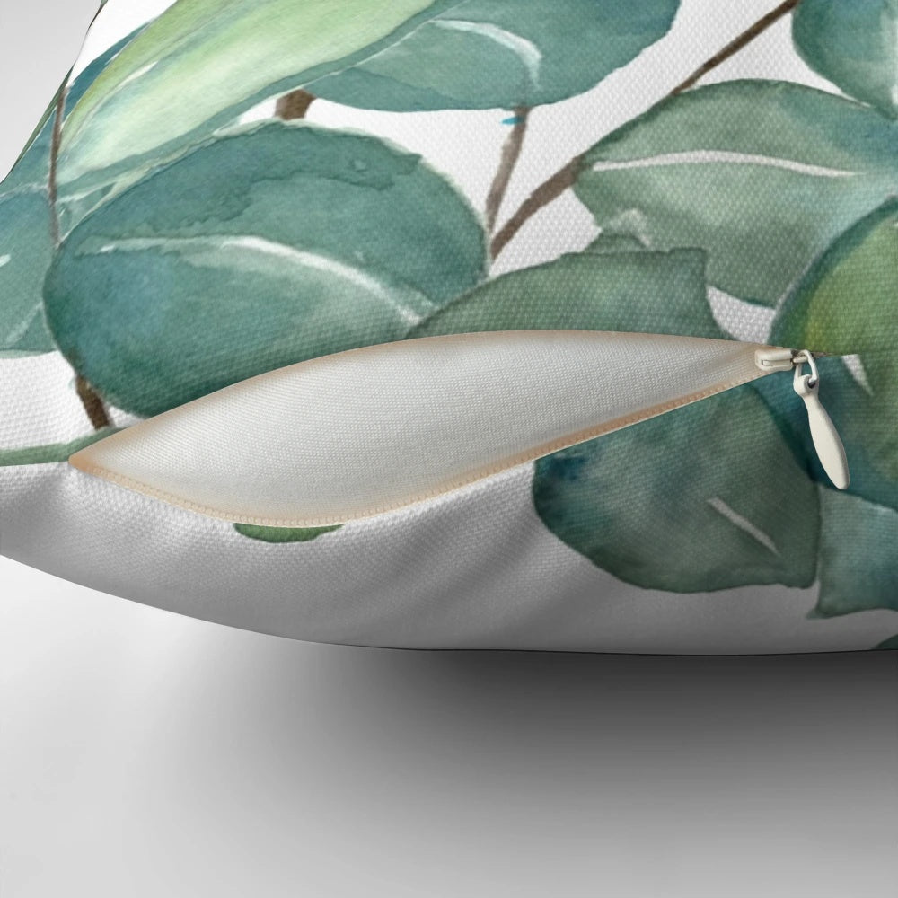 Vibrant watercolor painting of eucalyptus leaves on a soft, plush pillow.